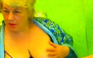 Blonde fat granny on webcam is proud of her big boobs